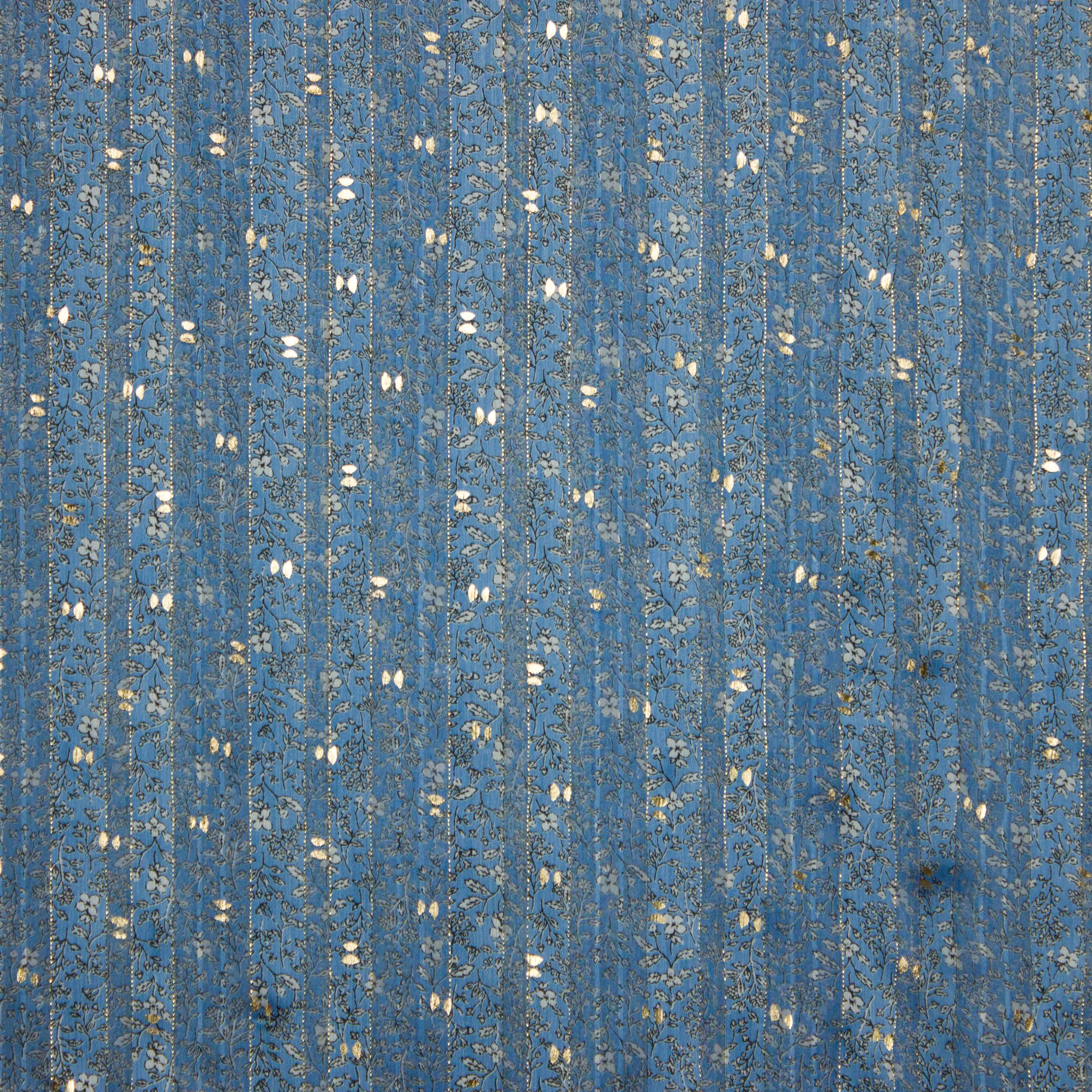 Voile blauw met bloempjes, goudvlokjes en een glinsterend draadje